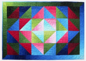 Glowing Jewels quilt by Jan Krentz